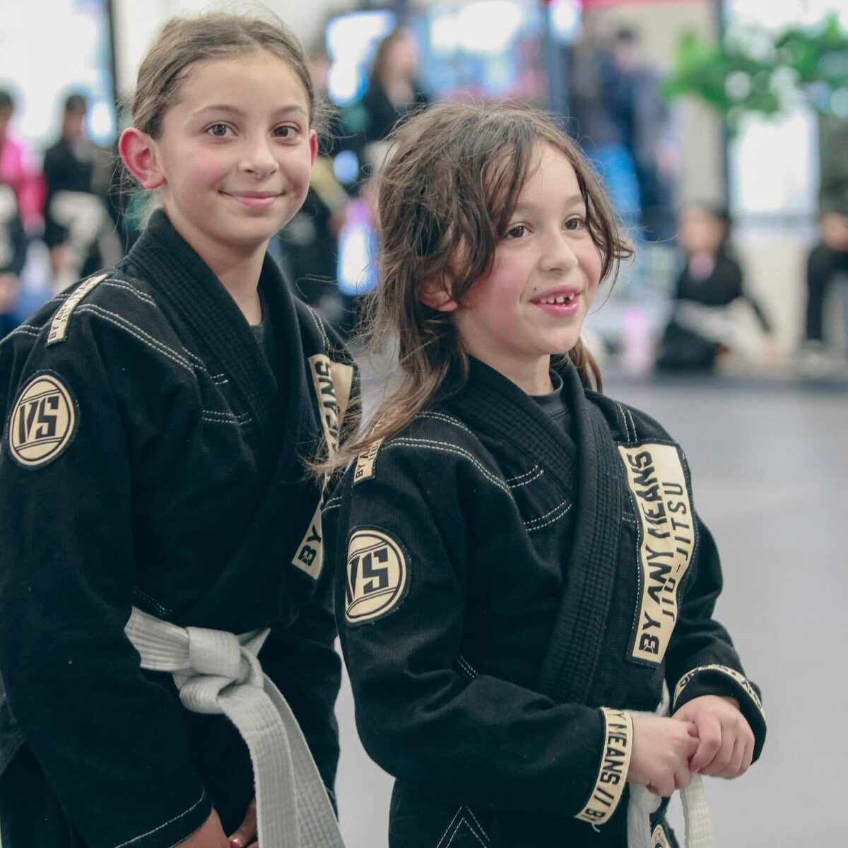 Two young students smiling