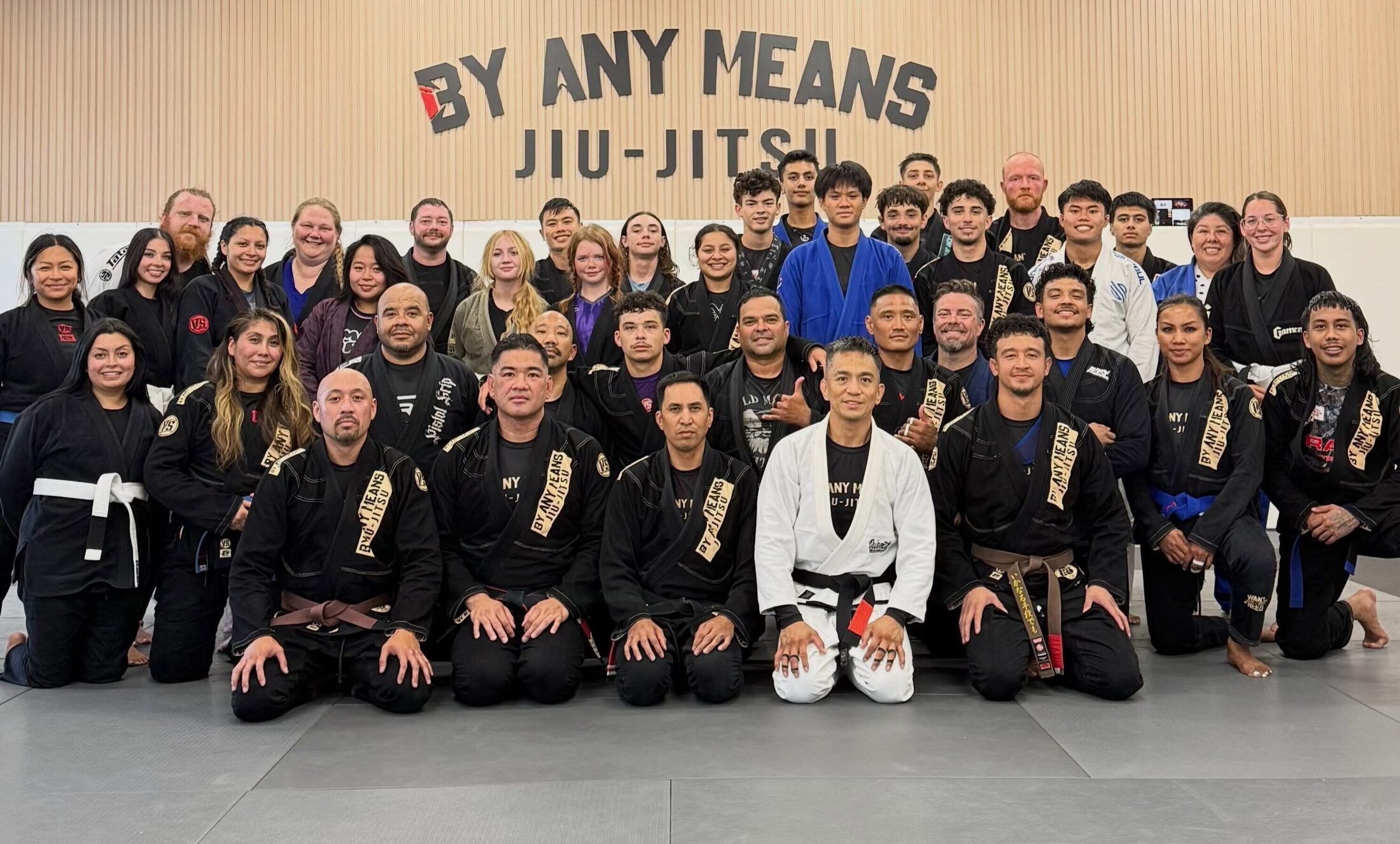The By Any Means Jiu-Jitsu academy together on the mat